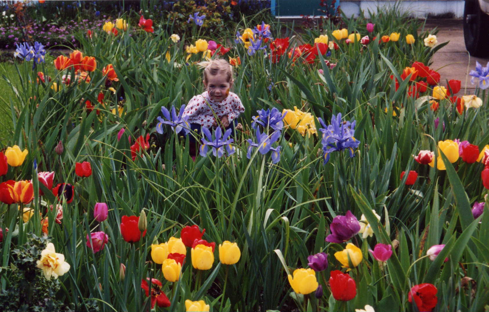 Jessica in Mom's Tulip Bed